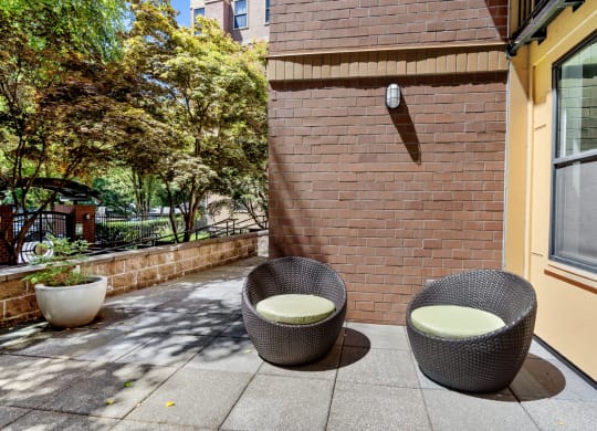 Outdoor patio chairs and table at Collins Circle apartments in the Goose Hollow district in Portland, Oregon.