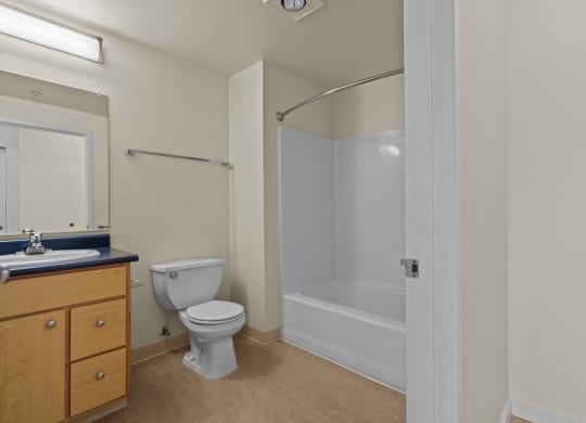 Bathroom with full tub/shower at Collins Circle apartments in the Goose Hollow district in Portland, Oregon.
