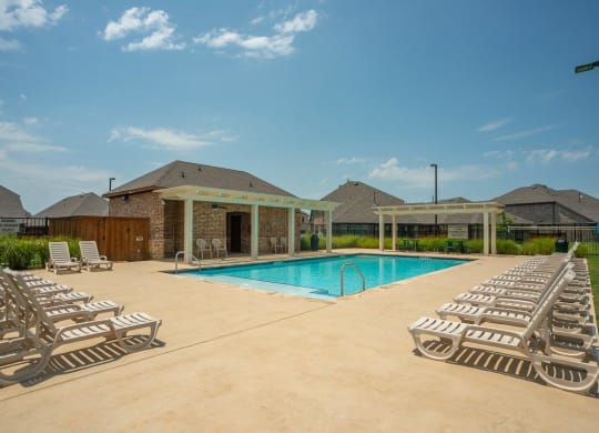 Cottages at the Realm Pool with Lounge Chairs