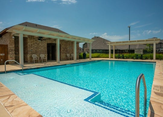 Cottages at the Realm Pool with Lounge Chairs