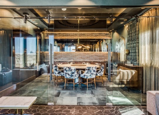 a dining room with a long table in the middle of it
