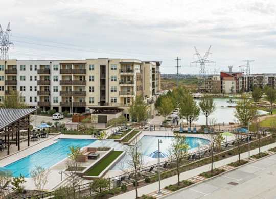 A large apartment complex with a pool and a water slide.