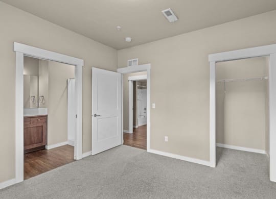 Dakota Flats Apartments in Spokane, Washington Bedroom with Attached Bathroom and Walk-In Closet