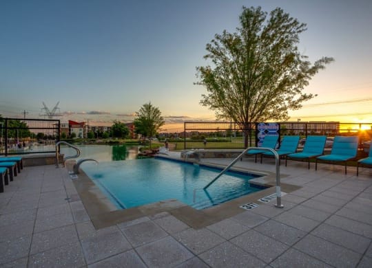 Discovery at The Realm in Lewisville, Texas Pool with Lounge Chairs