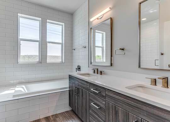 Bathroom with Double Vanity at Discovery at The Realm, Texas