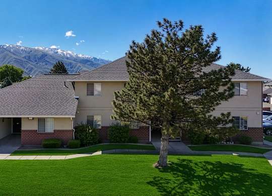 A house with a mountain in the background.