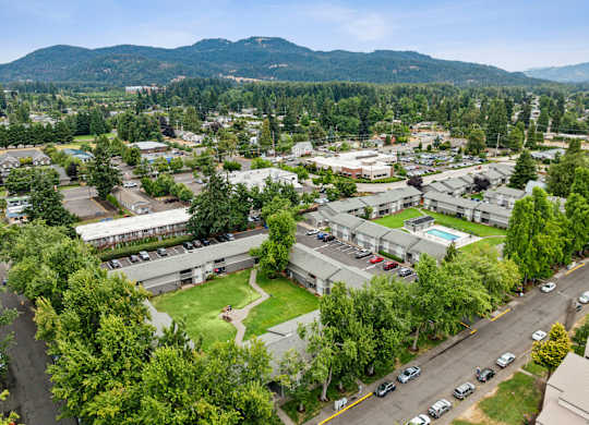 A view of a town with a lot of buildings and cars.
