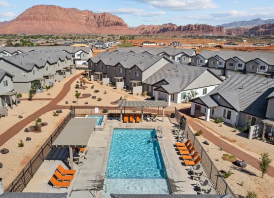 an aerial view of an apartment complex with a swimming pool