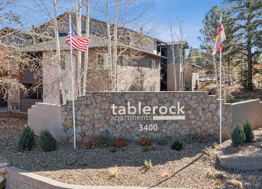 The image shows a sign for Tablerock Apartments with the number 3400 on it.