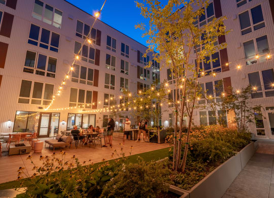 The Warren Apartments outdoor patio at night