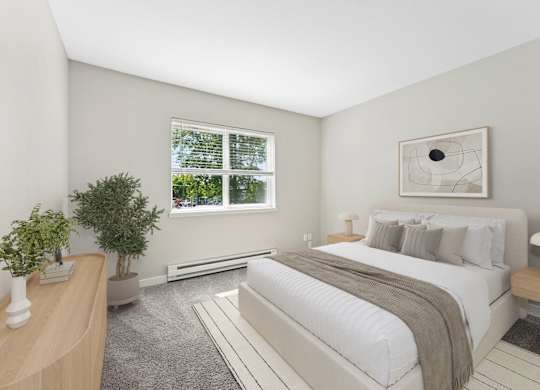 A bedroom with a large bed and a window.
