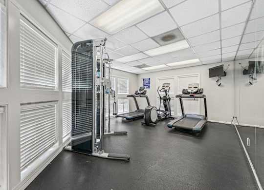 Clermont Oak Hills Portland Apartments Community Amenities fitness center with treadmills and weights
