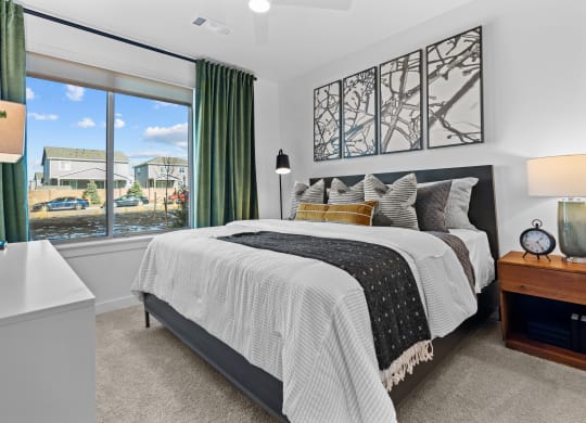 Aura Crossroads Apartments Bedroom with large bed and window