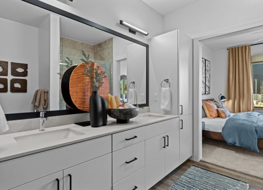 a bathroom with a large mirror and a sink