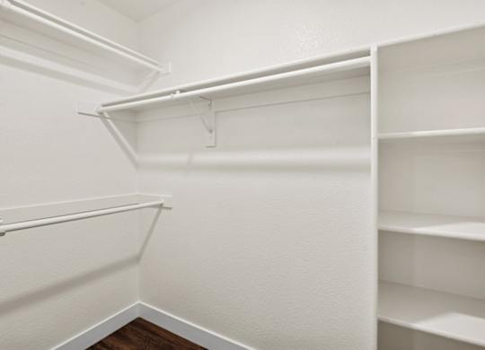Empty white shelves in a room.