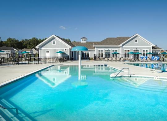 EVOLV at Stonehaven Townhomes in White Plains, Maryland Pool with Lounge Chairs