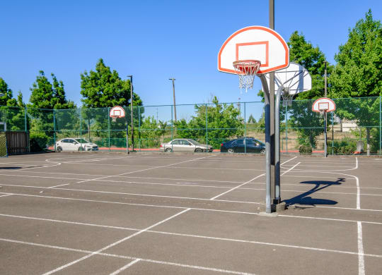 a basketball hoop in a parking lot