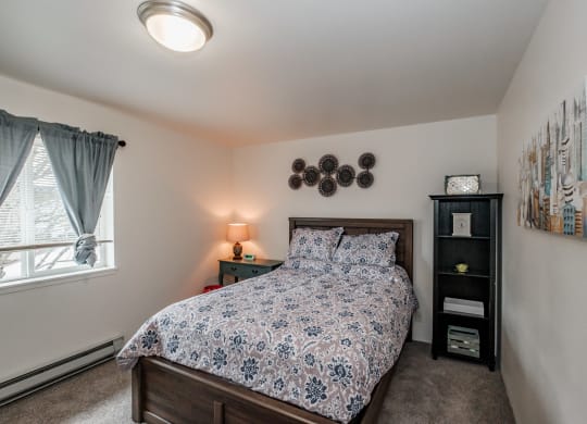 a bedroom with a bed and two night stands