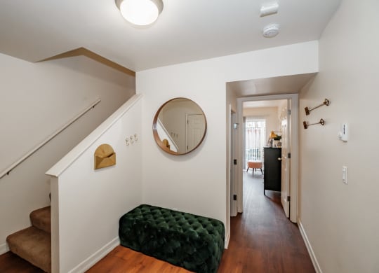 a view of the hallway from the top of the stairs