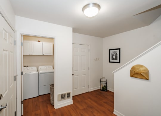 a small laundry room with a washer and dryer