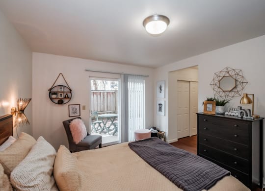 a bedroom with a bed and a dresser