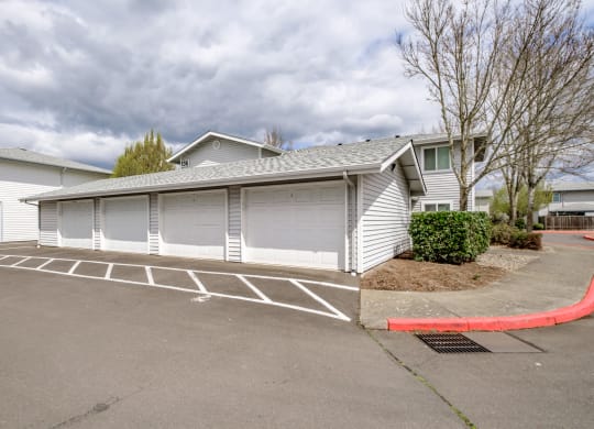 a garage with a carport in front of a house