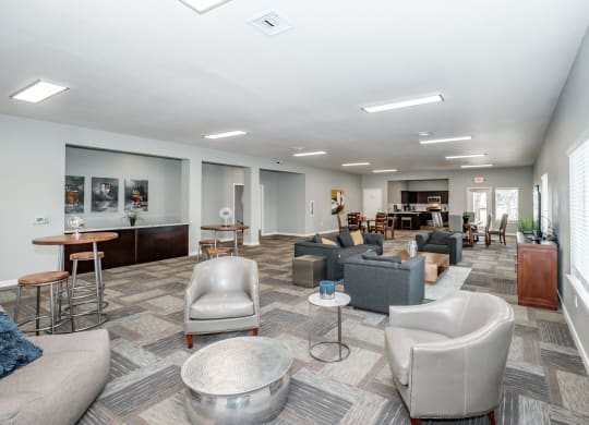 a common area with couches chairs and tables