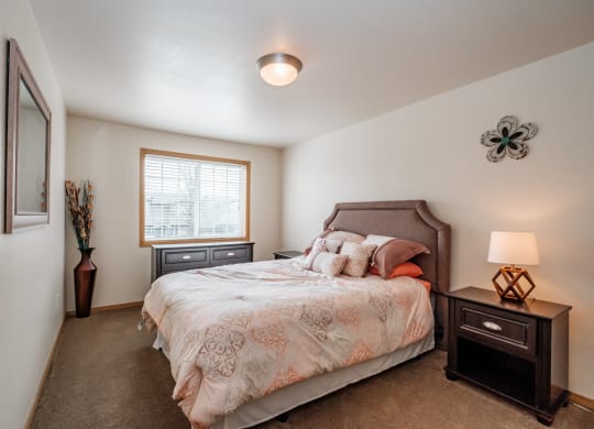 a bedroom with a bed and two night stands