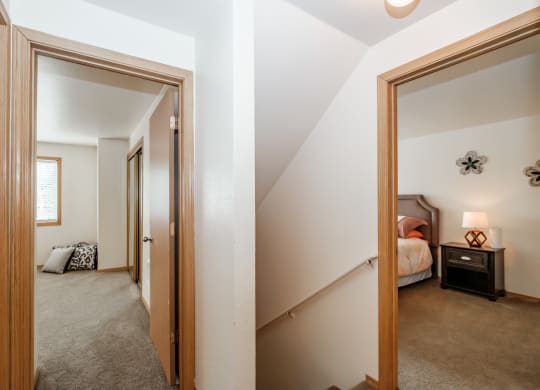 a view of the bedroom from the hallway