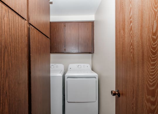 a small laundry room with a washer and dryer