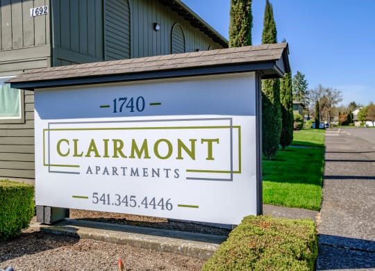 a sign for clairmont apartments