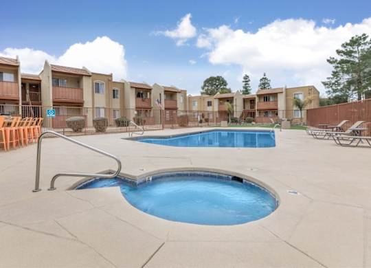 Fox Point Apartments in Tucson, Arizona Pool with Lounge Chairs and Hot Tub