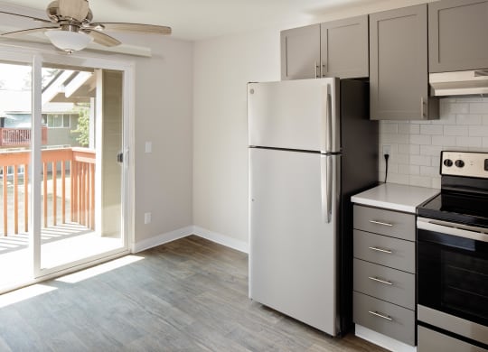 a kitchen and living room in a 555 waverly unit