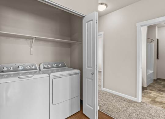 A laundry room with a washer and dryer.
