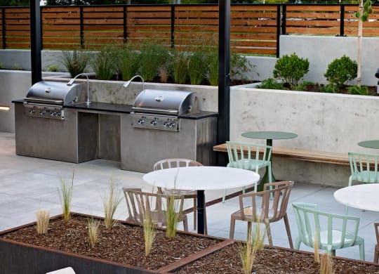 The Gabe Apartments in Portland, Oregon Patio with BBQ Grills and Fire Pit