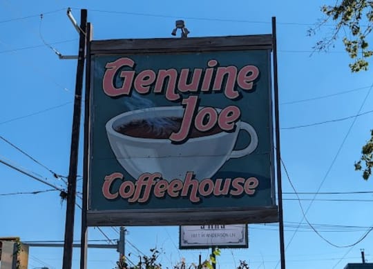 a sign for a on the side of the road