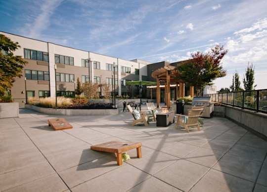 A sunny day at the outdoor seating area of a modern building.