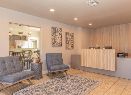 A reception area with two chairs and a reception desk.