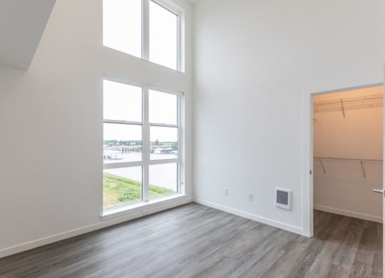 Harbor Sky Bedroom with Large Windows and Attached Walk-In Closet