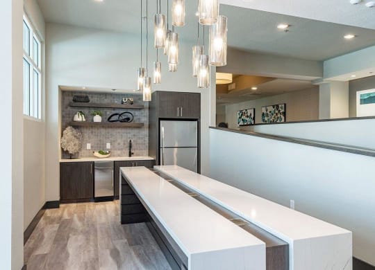 a kitchen with a long counter and a sink