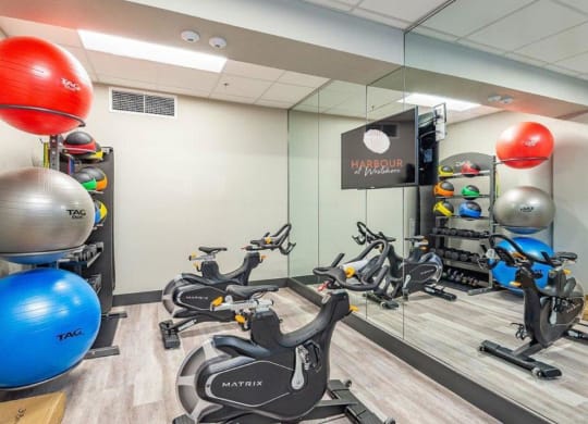 a room filled with lots of different types of exercise equipment