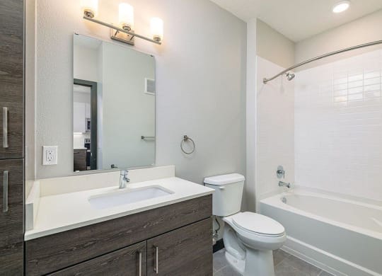 a bathroom with a toilet sink and bathtub