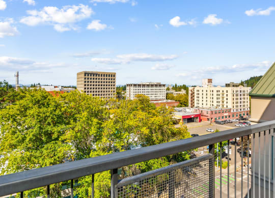 a view of the city from a balcony of a building
