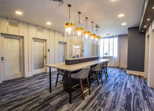 A conference room with a long table and chairs.