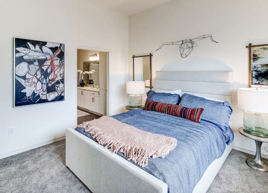 The Dylan bedroom with a bed and two lamps