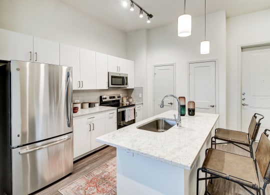 The Dylan kitchen with white cabinetry and stainless steel appliances
