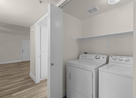 A laundry room with a washer and dryer.