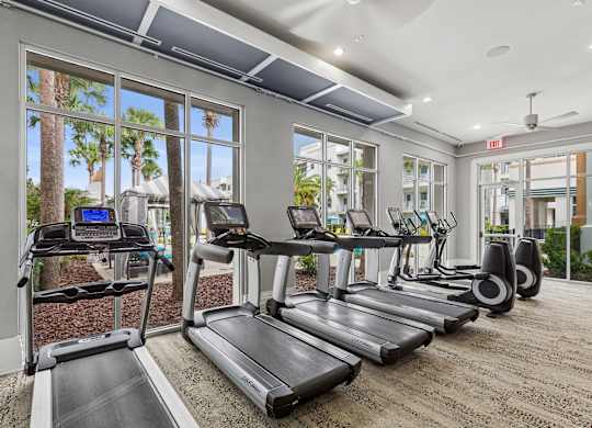 A gym with treadmills and exercise equipment.