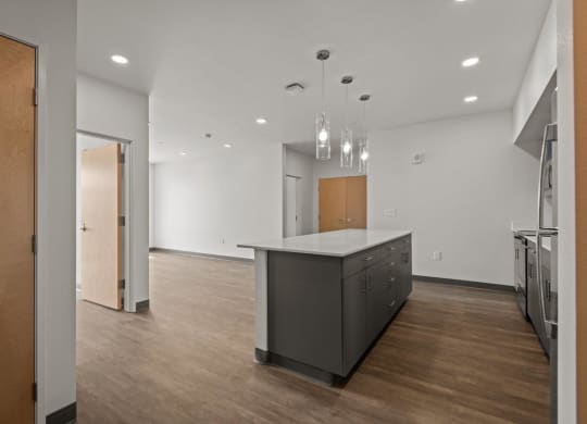 Kitchen with Island and cabinets at Ironside Apartments, Washington