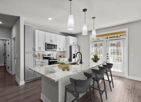 an open kitchen with a marble counter top at Lenox Grand, Austin Texas
